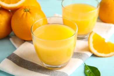 Photo of Composition with orange juice and fresh fruit on table