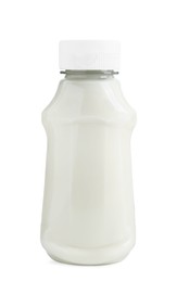 Photo of Fresh mayonnaise sauce in glass bottle isolated on white