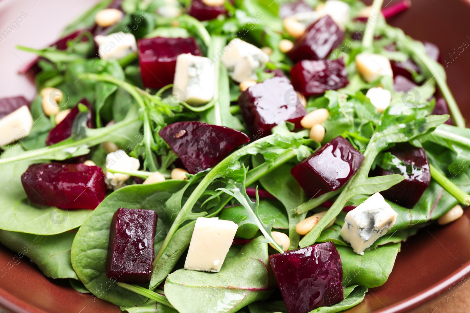 Photo of Fresh delicious beet salad on plate, closeup