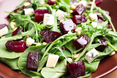 Photo of Fresh delicious beet salad on plate, closeup