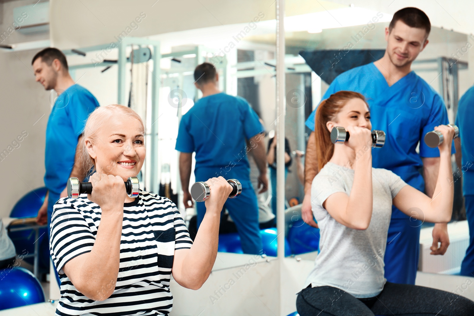 Photo of Patients exercising under physiotherapist supervision in rehabilitation center