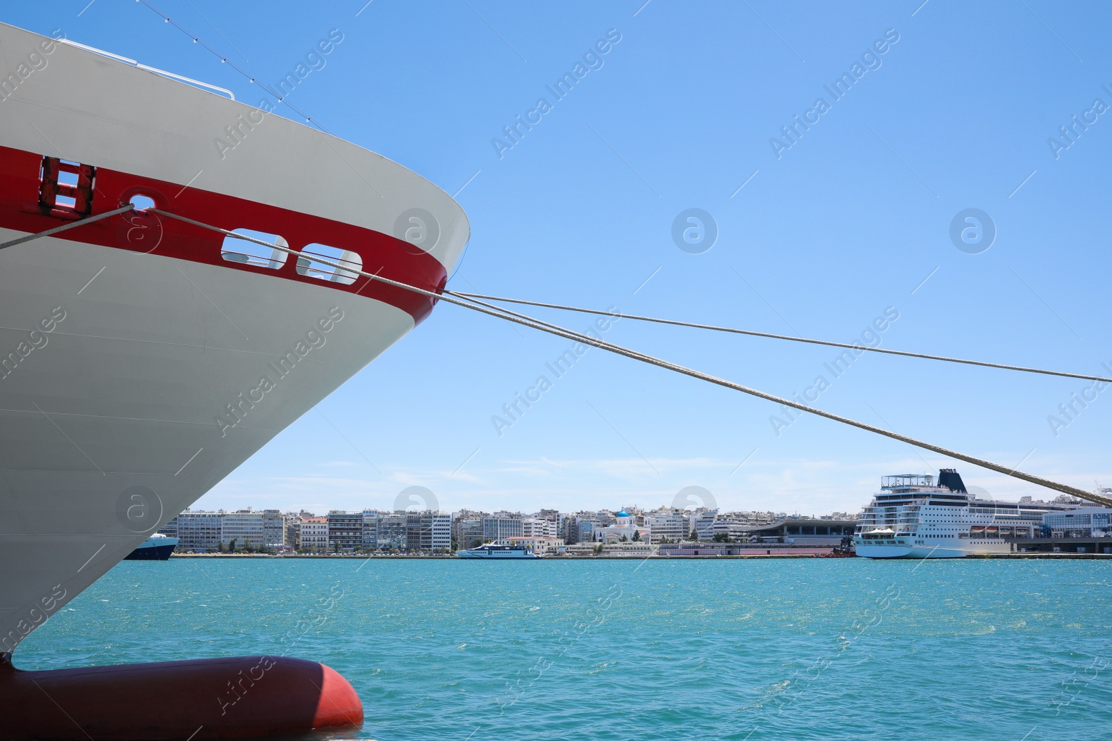 Photo of Modern ferry moored in sea port on sunny day