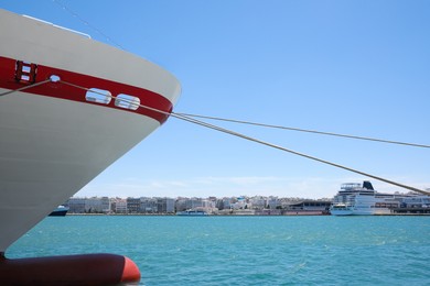 Modern ferry moored in sea port on sunny day