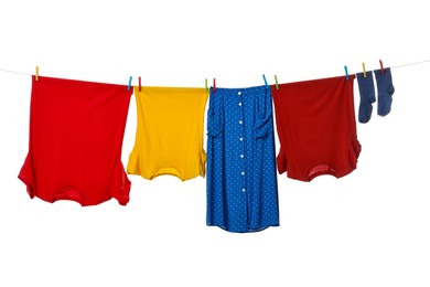 Photo of Different clothes drying on laundry line against white background