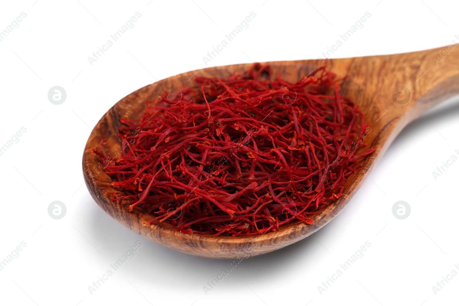 Photo of Aromatic saffron in spoon isolated on white