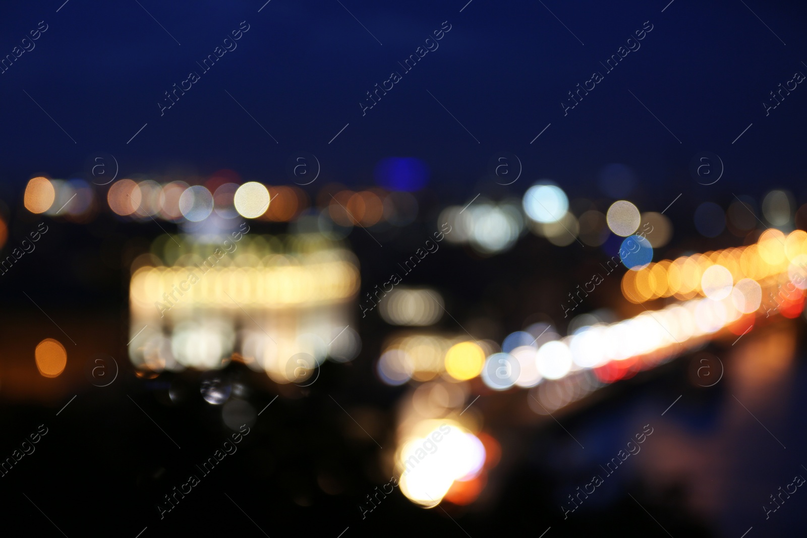 Photo of Blurred view of beautiful city at night. Bokeh effect