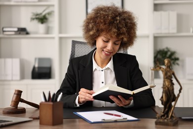 Notary with notebook at workplace in office