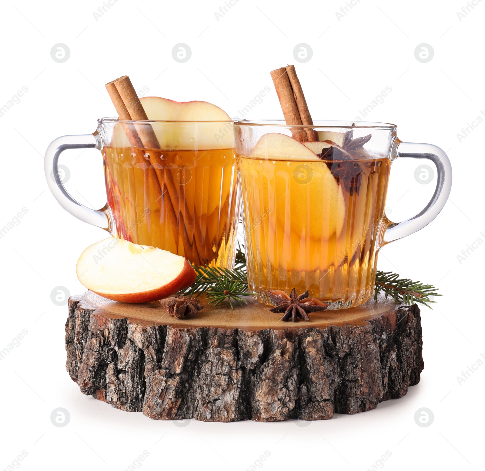 Photo of Hot mulled cider, ingredients and fir branches on white background