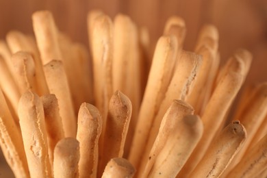 Many fresh delicious grissini sticks, closeup view