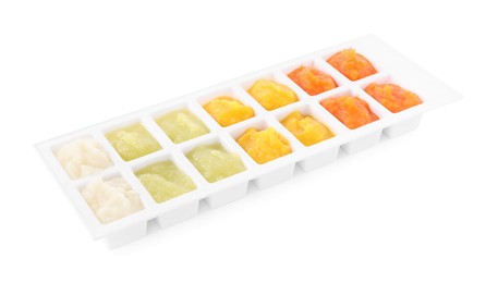 Photo of Different purees in ice cube tray on white background. Ready for freezing