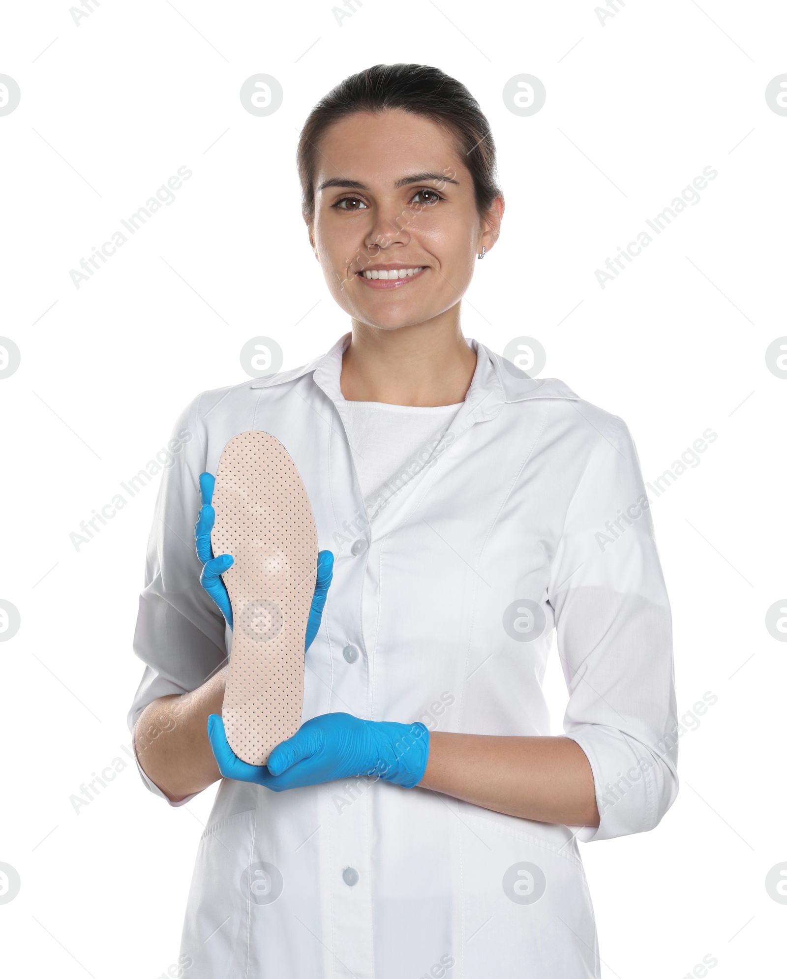 Photo of Beautiful female orthopedist showing insole on white background