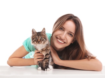 Young woman with cat on white background. Owner and pet