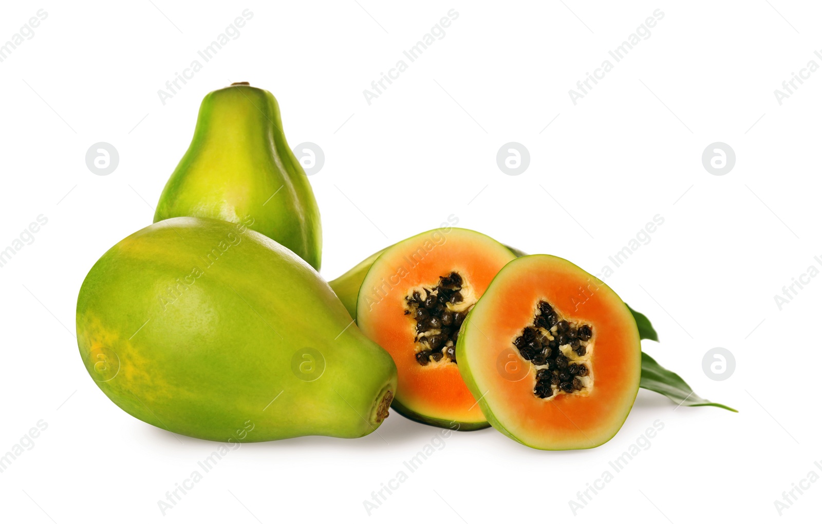 Photo of Fresh ripe papaya fruits with green leaves on white background