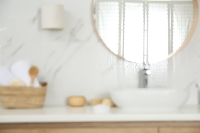 Photo of Blurred view of stylish modern bathroom with mirror