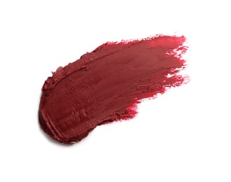 Photo of Smear of bright lipstick on white background, top view