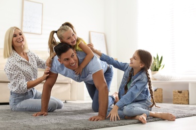 Happy family spending time together at home