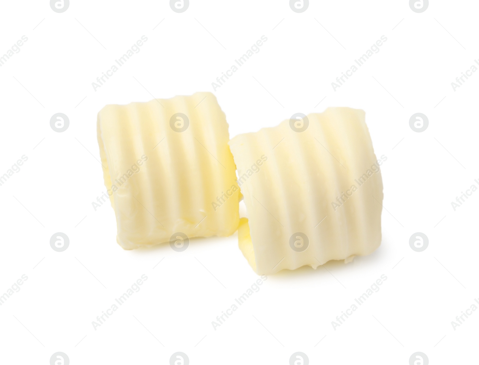 Photo of Two tasty butter curls isolated on white