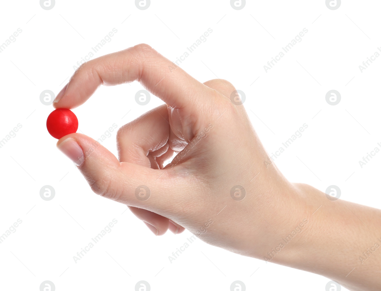 Photo of Woman holding color pill on white background, closeup