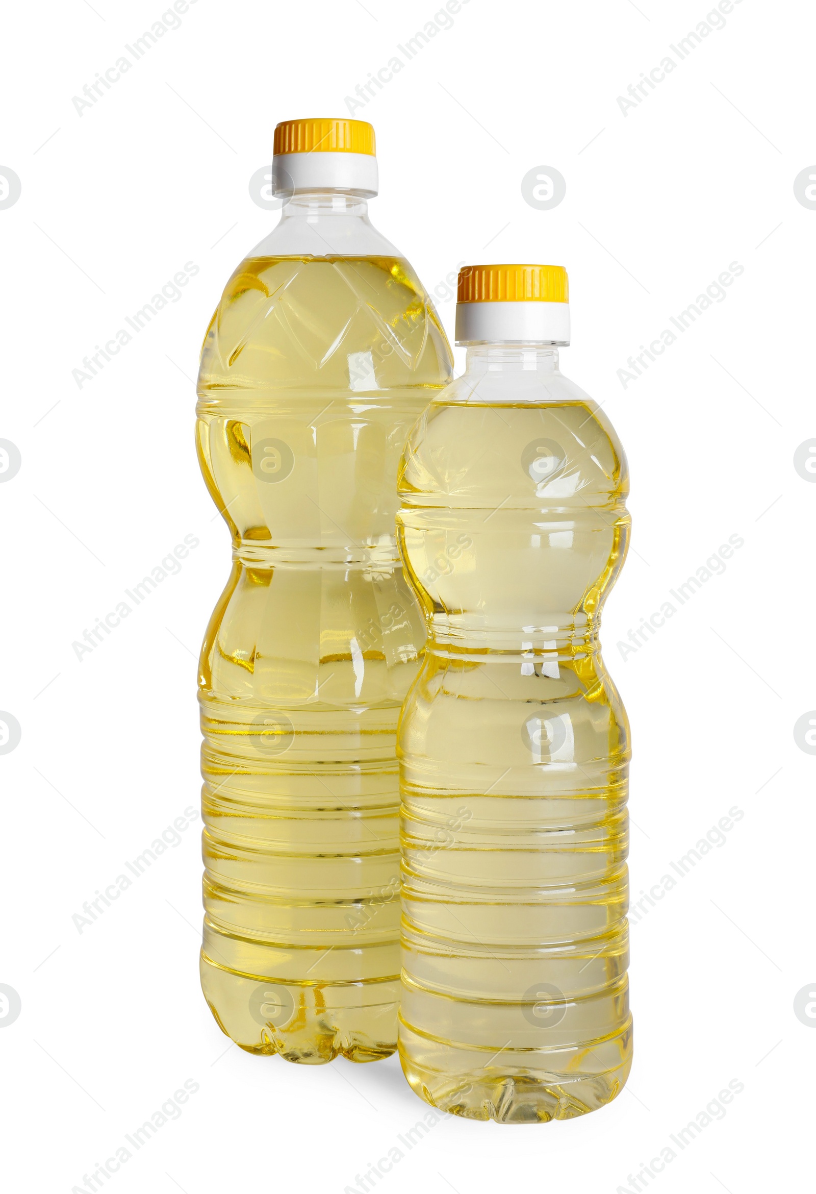 Photo of Bottles of cooking oil on white background