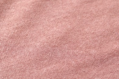 Texture of soft pink fabric as background, closeup