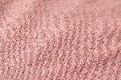 Photo of Texture of soft pink fabric as background, closeup