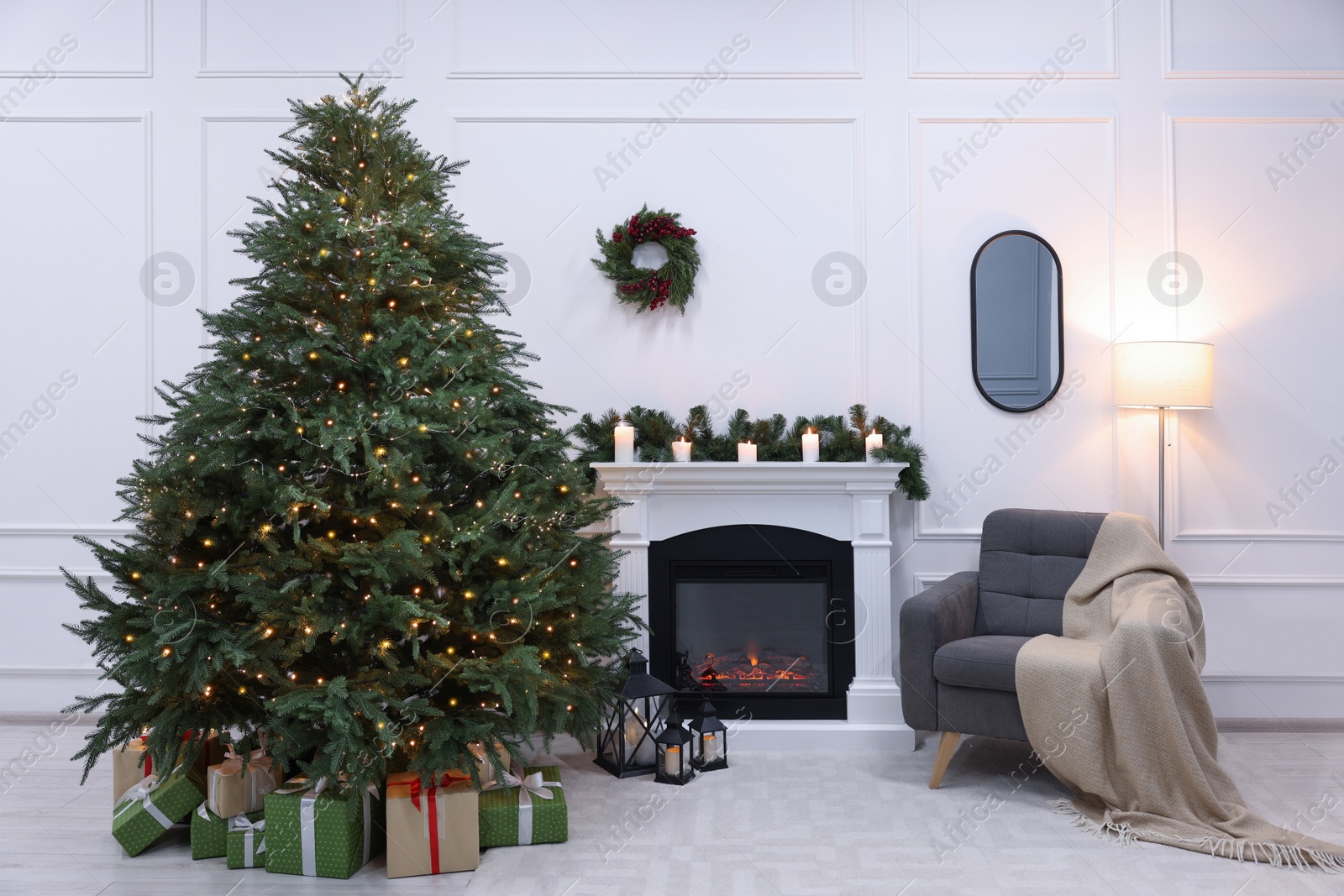 Photo of Beautiful living room interior with decorated Christmas tree