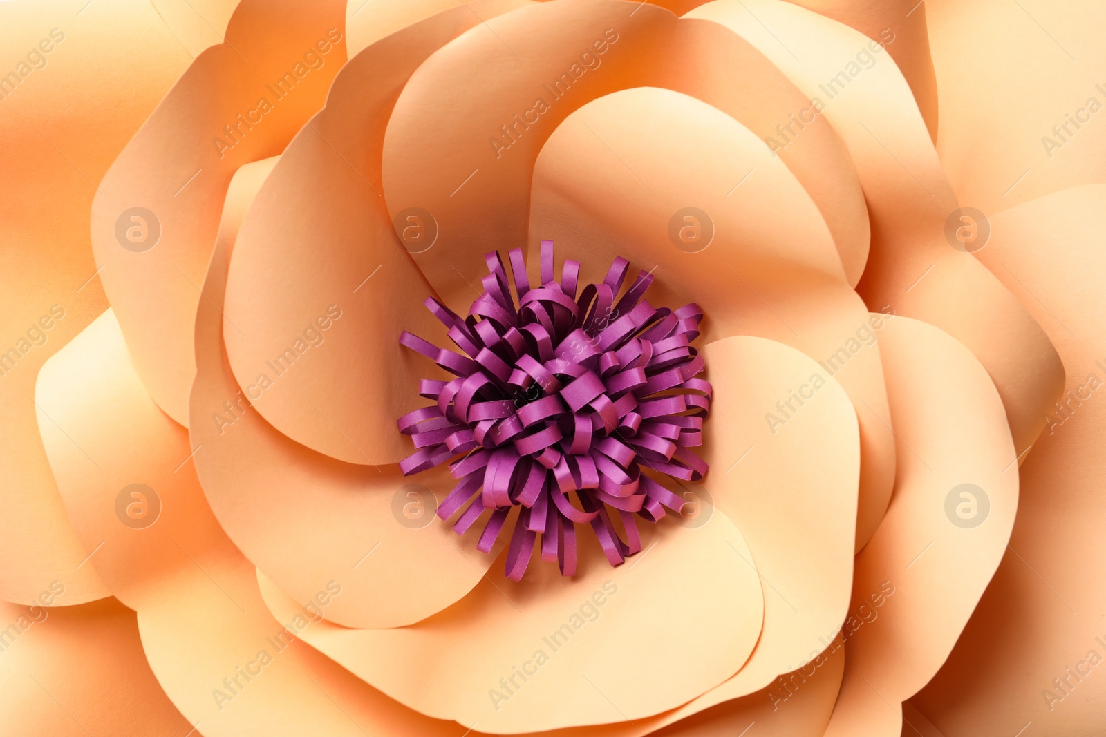 Photo of Beautiful yellow flower made of paper as background, top view