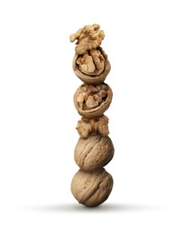 Image of Stack of many walnuts on white background