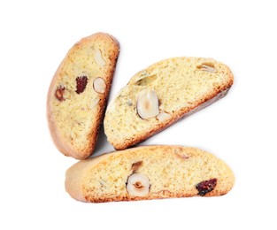 Photo of Slices of tasty cantucci with berry and pistachio on white background, top view. Traditional Italian almond biscuits