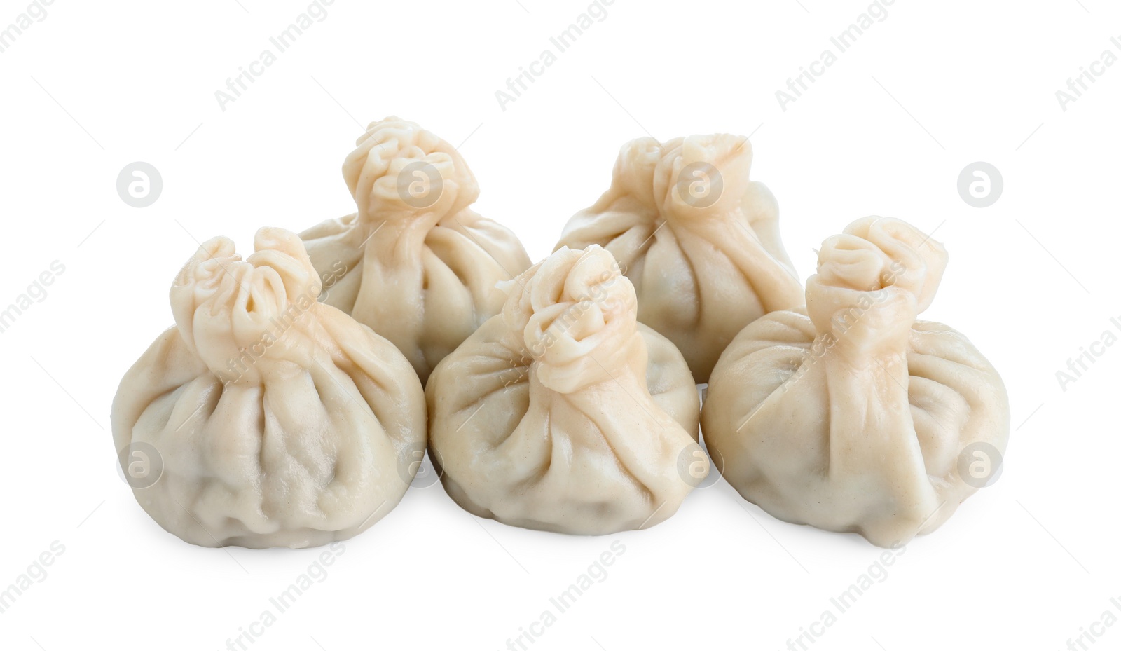 Photo of Many tasty khinkali (dumplings) isolated on white. Georgian cuisine