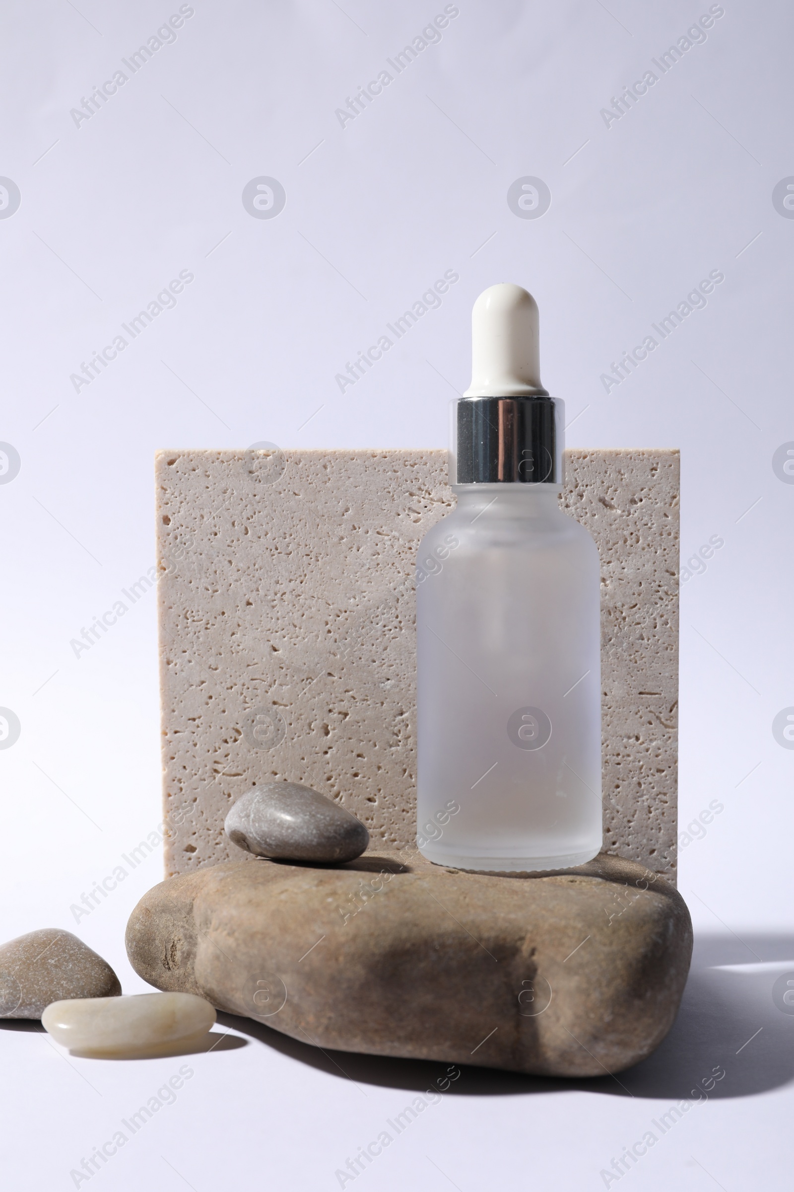 Photo of Composition with bottle of cosmetic serum on white background