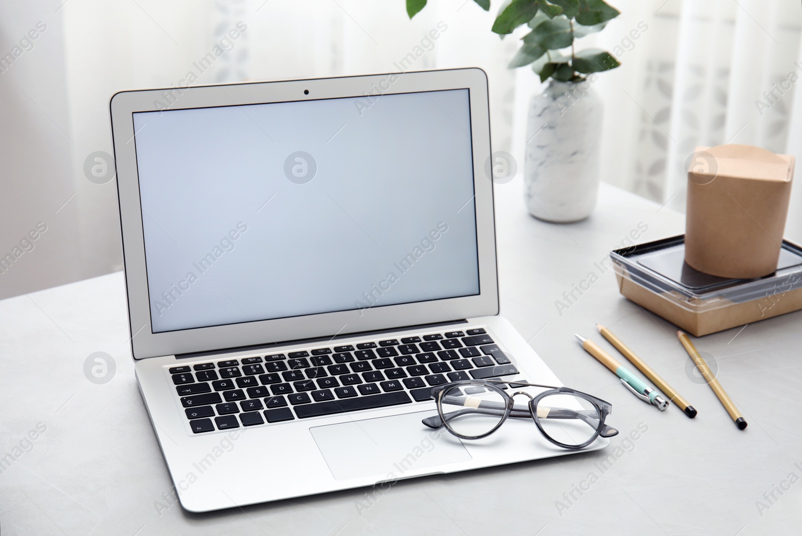 Photo of Cozy blogger workplace with laptop at home