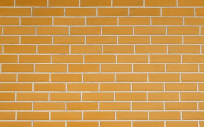 Image of Texture of orange color brick wall as background