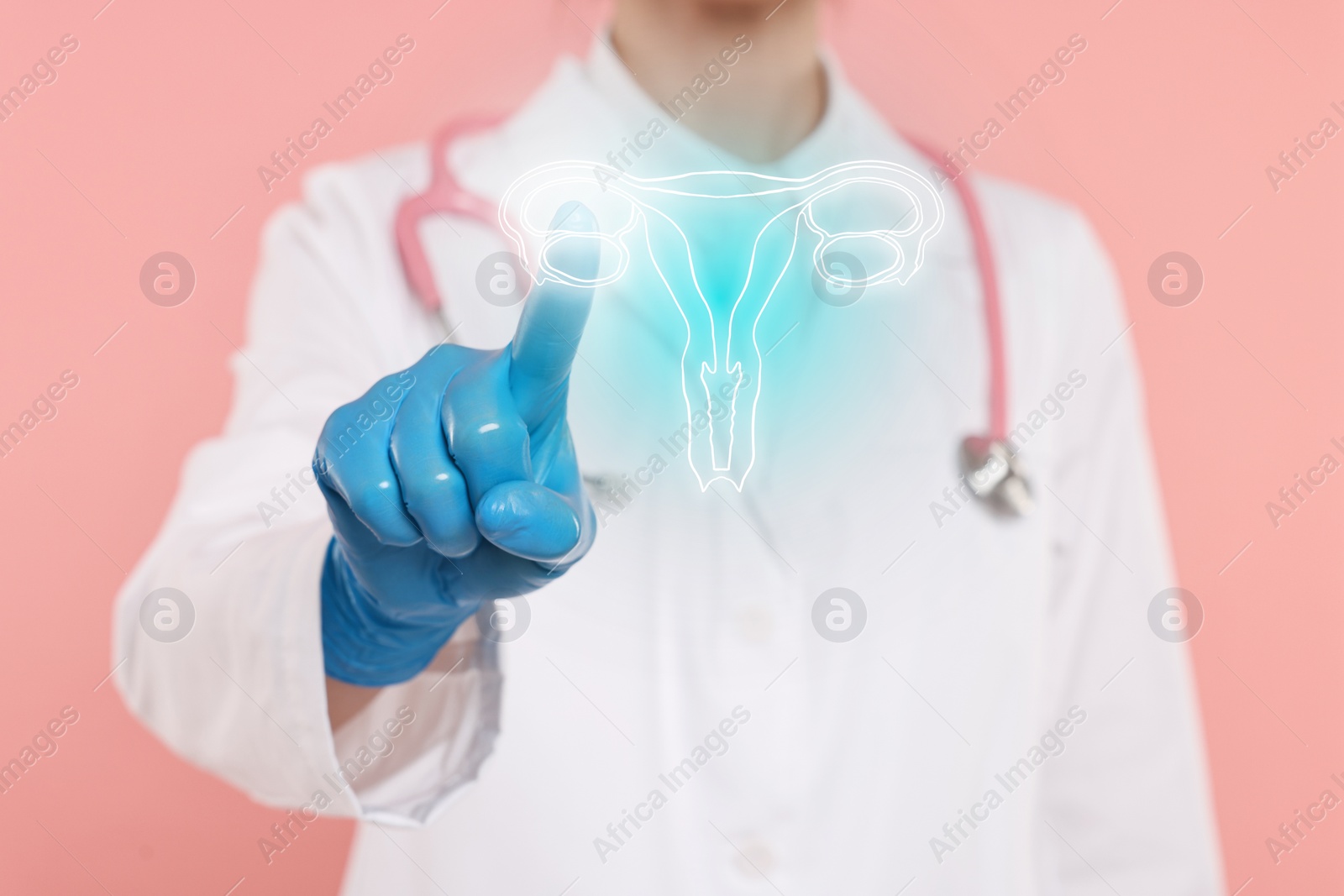 Image of Doctor and illustration of female reproductive system on pink background, closeup