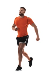 Young man in sportswear running on white background