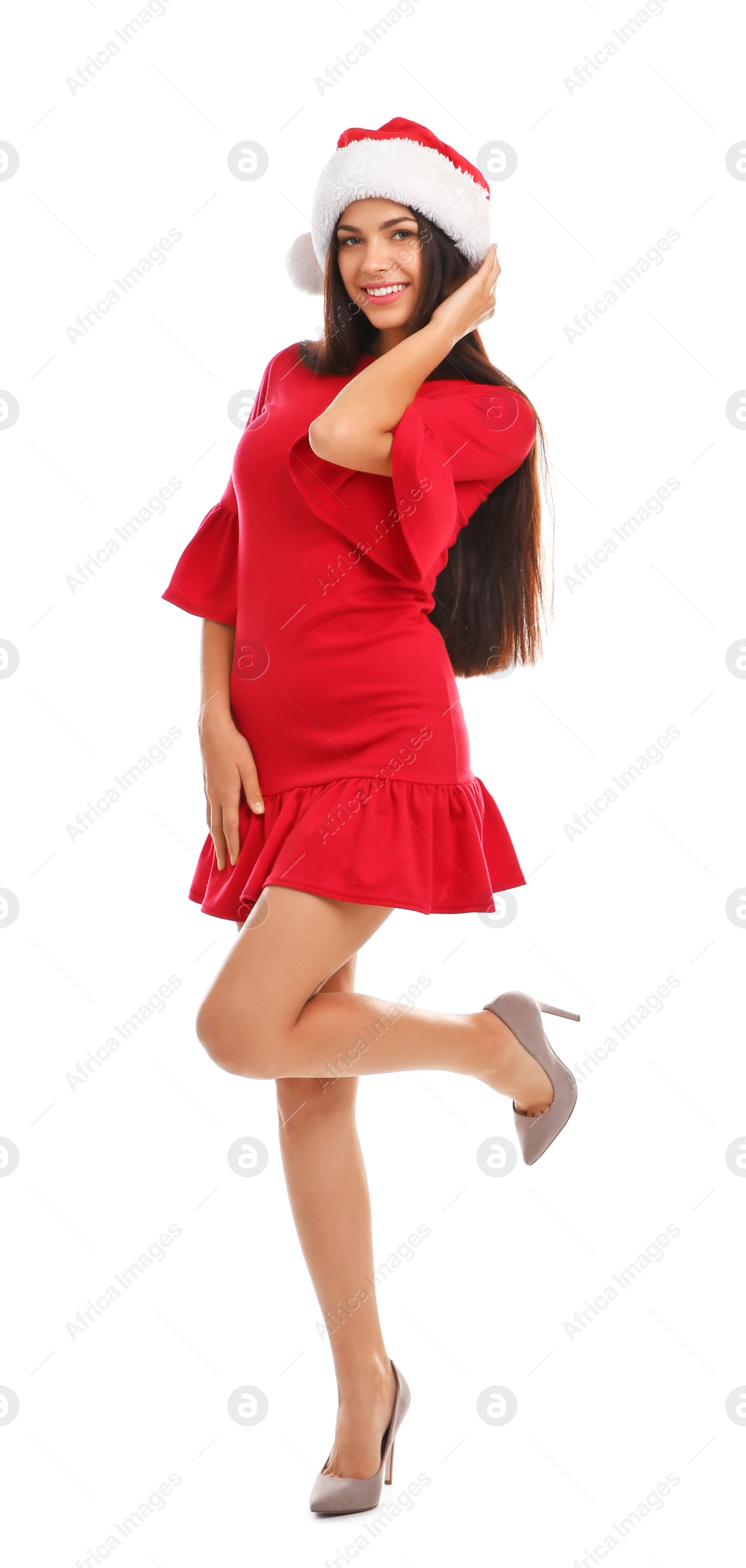 Photo of Young beautiful woman in Santa hat on white background. Christmas celebration