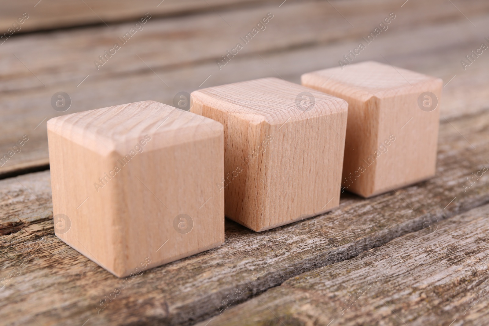 Photo of International Organization for Standardization. Cubes with abbreviation ISO on wooden table, closeup