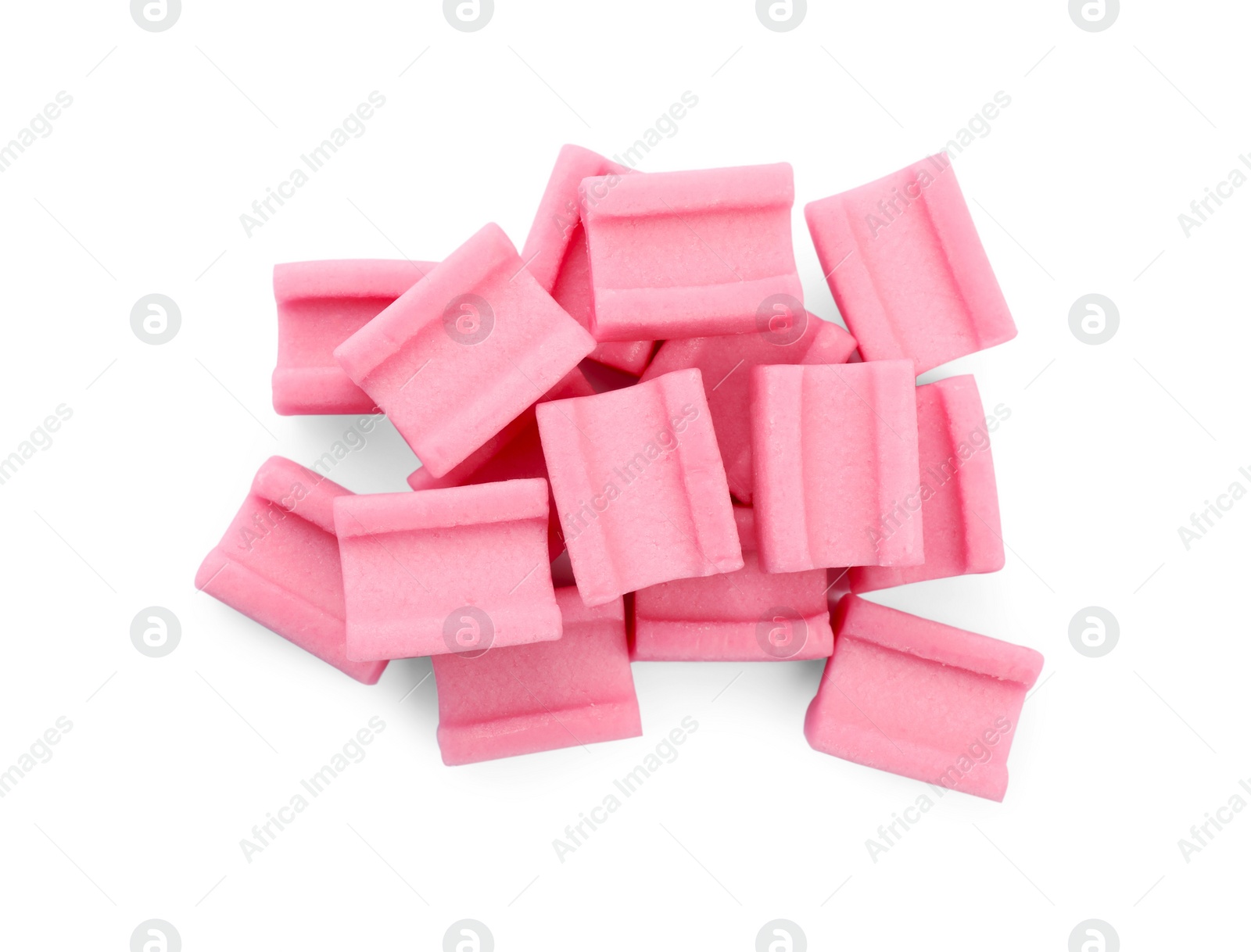 Photo of Pile of tasty pink chewing gums on white background, top view