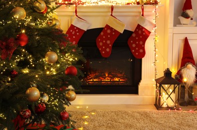 Photo of Living room interior with fireplace and festive decor. Christmas celebration