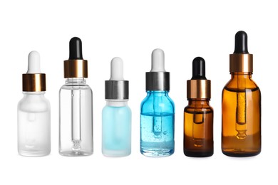 Image of Serums in different bottles isolated on white, collection