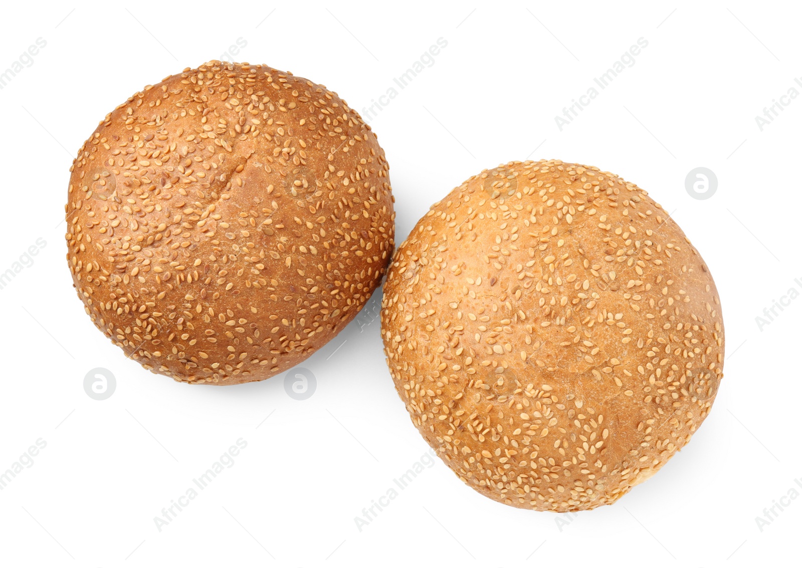 Photo of Fresh hamburger buns with sesame seeds isolated on white, top view