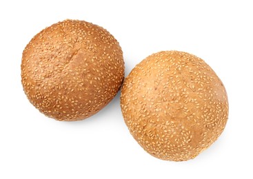 Fresh hamburger buns with sesame seeds isolated on white, top view