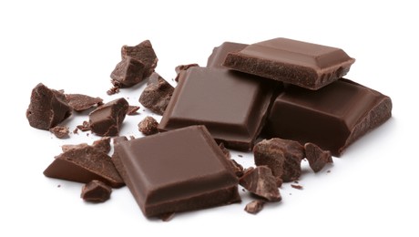 Photo of Pieces of delicious dark chocolate bar on white background