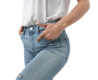 Woman wearing jeans on white background, closeup