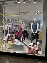 WARSAW, POLAND - JULY 17, 2022: Sportswear store display with clothes on mannequins in shopping mall