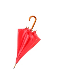 Photo of Modern closed red umbrella isolated on white