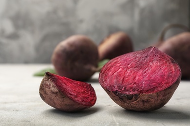 Photo of Cut ripe beet on table, close up