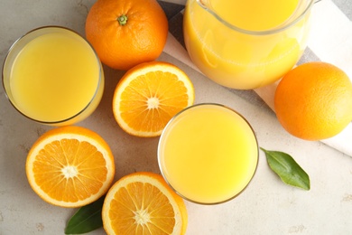 Photo of Flat lay composition with orange juice and fresh fruit on light background