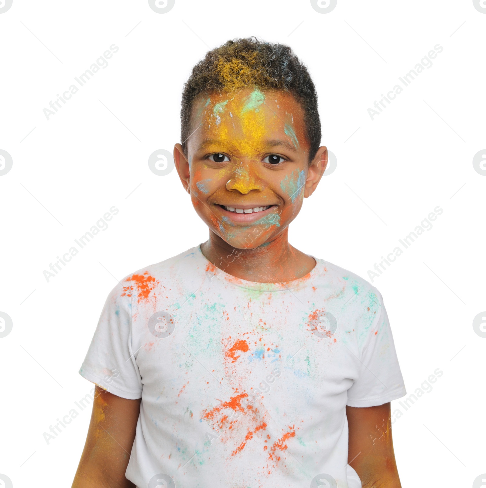 Photo of African American boy covered with colorful powder dyes on white background. Holi festival celebration