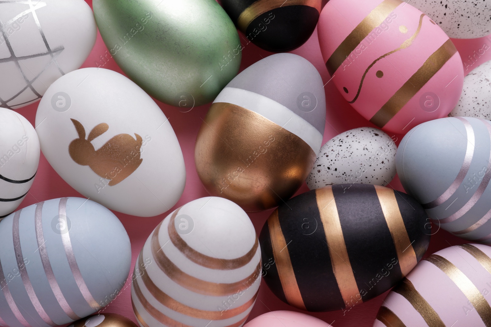 Photo of Beautifully painted Easter eggs as background, top view